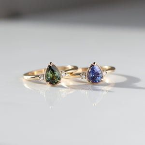 Pear Cut Purple and Green Sapphire rings front view 