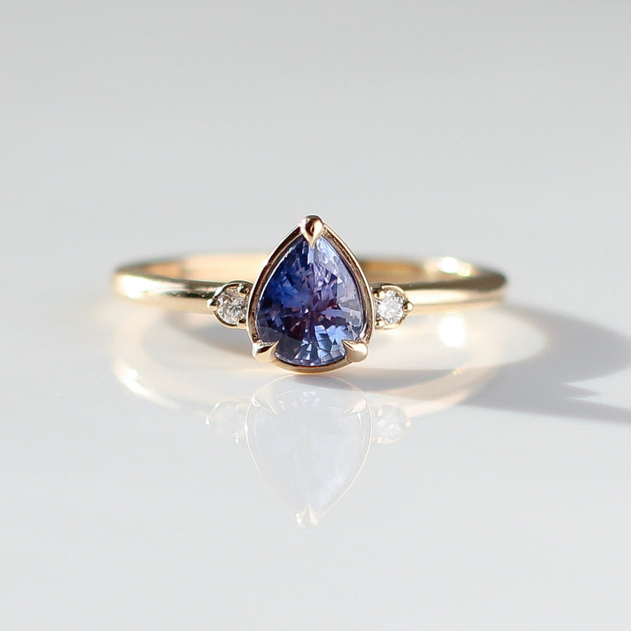 Pear Cut Purple Sapphire ring with reflections front view 