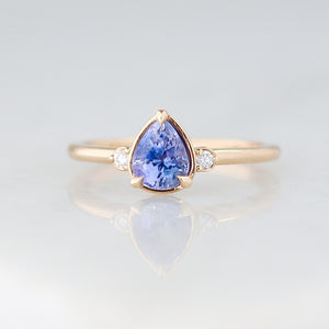 Pear Cut Purple Sapphire ring in yellow gold front view