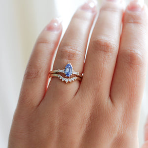 Shield Cut Blue Sapphire Ring with wave diamond band on hand 