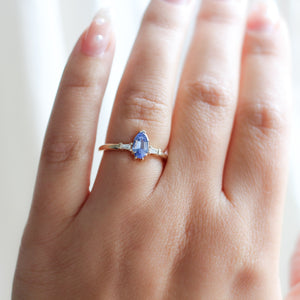 Shield Cut Blue Sapphire Ring in sunlight on hand