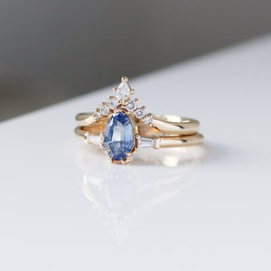 Shield Cut Blue Sapphire Ring with crown diamond band quarter close up view