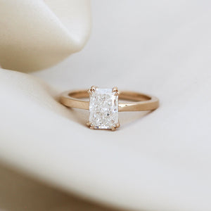 Radiant Cut Lab Diamond Ring on fabric quarter view