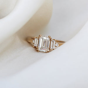 Emerald Cut Lab Diamond Ring on fabric close up