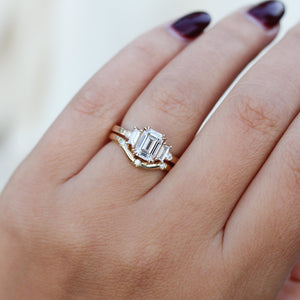 Emerald Cut Lab Diamond Ring paired with diamond gold band worn on hand close up detail view 