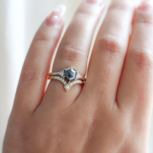 Hexagon Cut Black Diamond Ring with diamond gold band on hand in sunlight