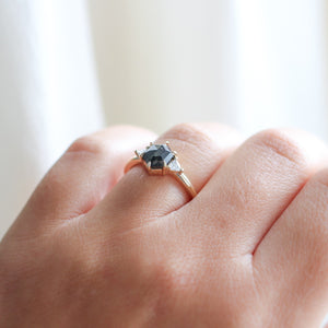 Hexagon Cut Black Diamond Ring on hand in sunlight