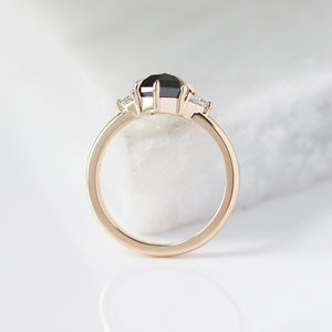 Hexagon Cut Black Diamond Ring on marble profile view