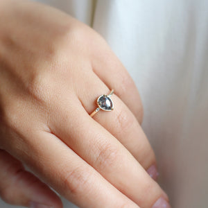 Pear Cut Salt & Pepper Diamond Ring on hand in sunlight