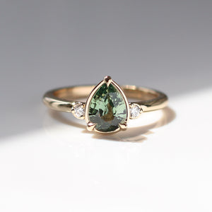 Pear cut green sapphire engagement ring