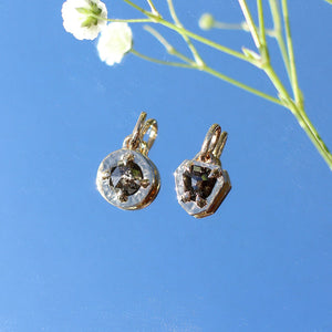 Shield Rustic Diamond Pendants on a mirror in light with flowers